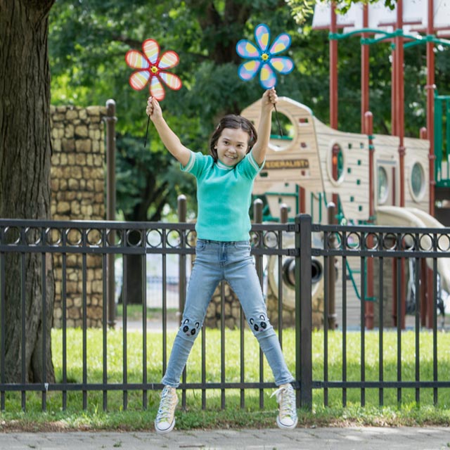 Common Questions-jumping girl with flower pinwheels